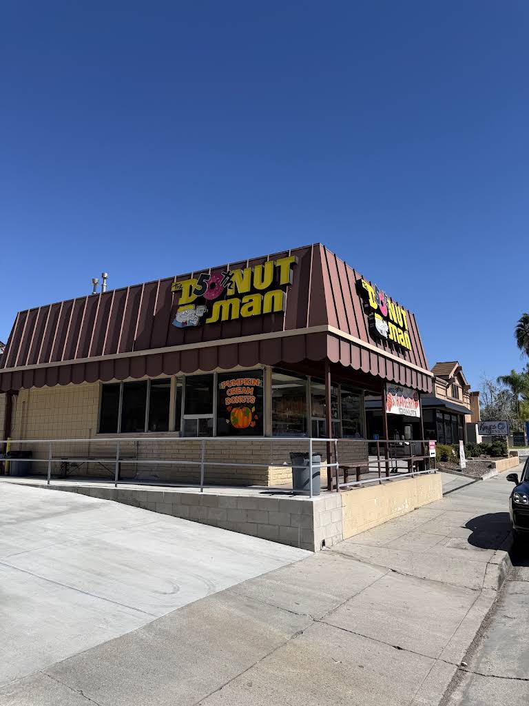 The Donut Man storefront and yellow sign at 915 East Route 66 in Glendora.